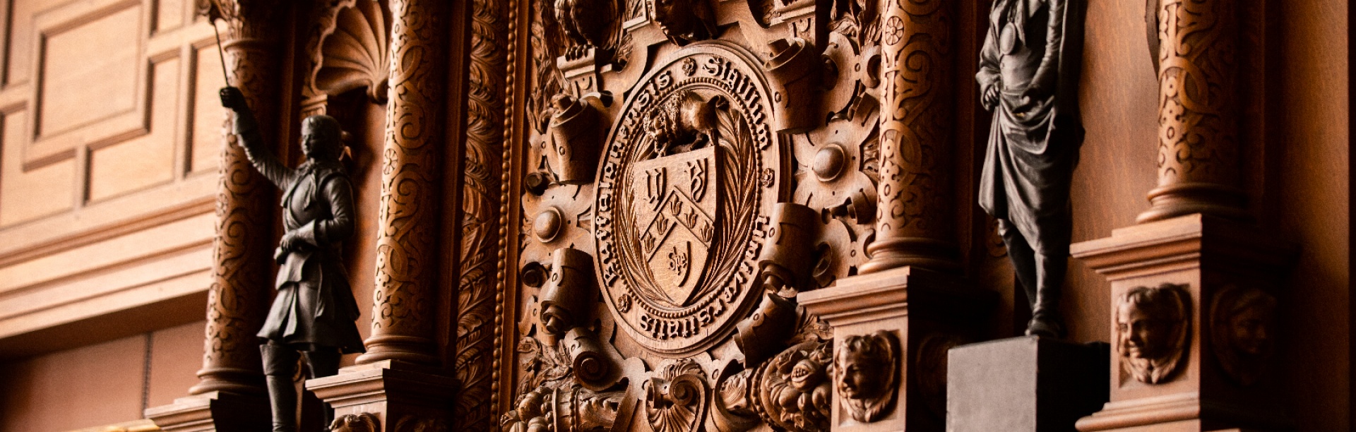 The UB seal and fireplace in the Health Sciences Library in Abbott Hall on South Campus. 