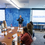 A speaker presents to a small group. 