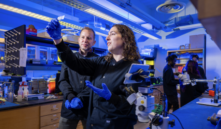 A UB faculty member and student in a lab. 