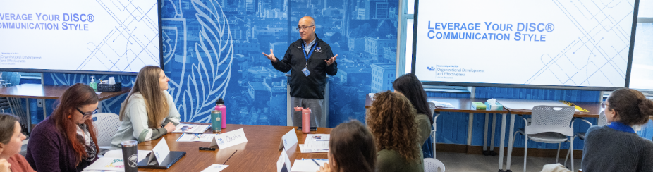 A staff member presents to a small group. 