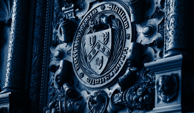UB Crest with blue color overlay. 
