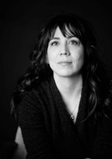 A photo of Jessica Nordell in a black sweater and looking at the camera. 