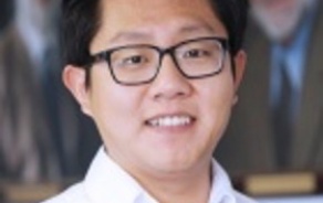 Man smiling at the camera. 