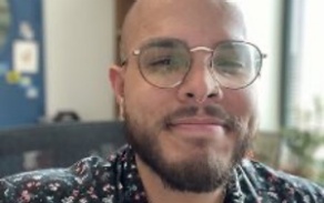 Man smiling at the camera. 