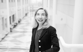 Black and white photo of blonde woman. 
