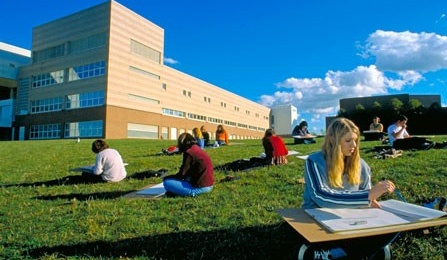 Students sketching on lawn outside Clemens Hall. 