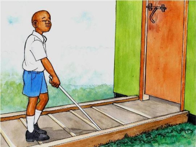 Tactile strips and an upstand on a path to a toilet (Tanzania), Susana Secretariat, 2011, Modified. 