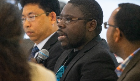 Theo speaking at the 6th Annual Western New York Refugee Health Summit. 
