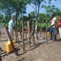 Jim, Chris, and Kory observing water resources in Uganda. 
