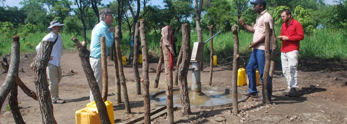 Jim, Chris, and Kory observing water resources in Uganda. 