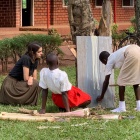 Kennedy George with students in Uganda. 