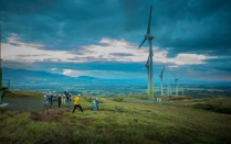 Windmills and students at dusk in Costa Rica. 