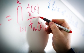 Writing on a whiteboard. 