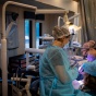 A dental assistant providing care to a patient in the van. 