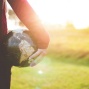 Image of a person holding a globe. 