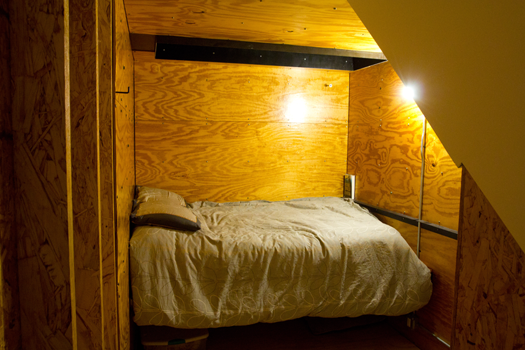 a small bedroom showing a bed and walls