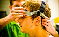 Photo of concussion sufferer wearing testing apparatus. 