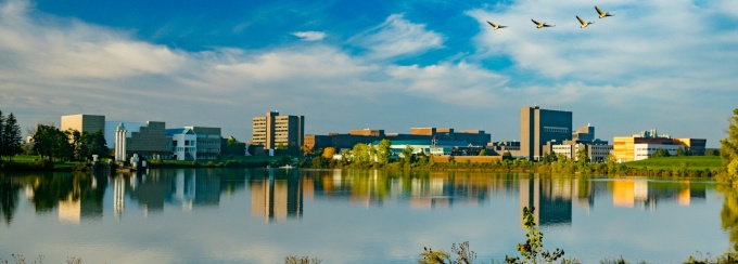 North campus exterior fall landscape images over Lake LaSalle. Photographer: Douglas Levere. 