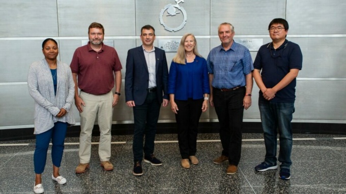 six people posing including dr. lisa keefe. 