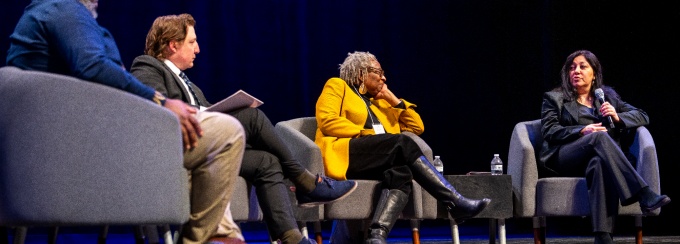 Speakers on stage at the Inclusive Excellence Symposium. 