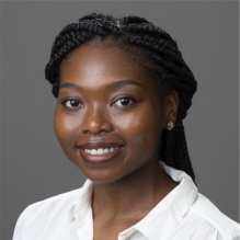 Deidra Ward smiling in a headshot with a white shirt. 