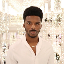 Rashad with beaded background. 
