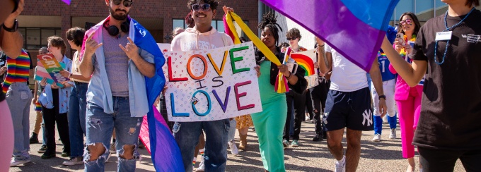 Students marching in the UB pride parade. 