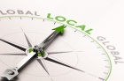 Compass pointing to global local. 