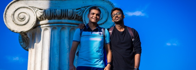 Two students smiling outside at Baird Point. 