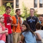 students outside a residence hall. 