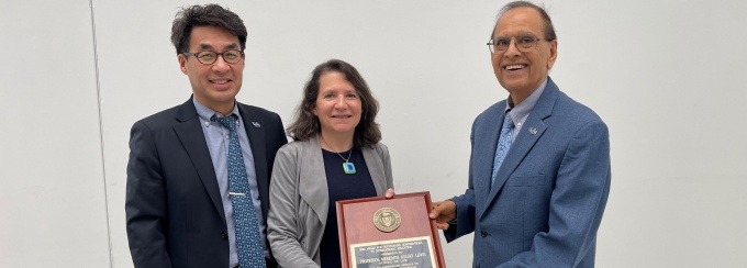 Vice Provost Nojin Kwak and President Satish Tripathi pose with Professor Meredith Kolsky Lewis, 2024 recipient of the Annual CISP Award for Outstanding Contributions to International Education. 