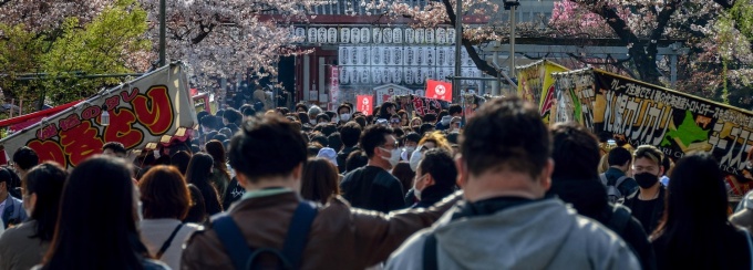 people walking down an outdoor street. 