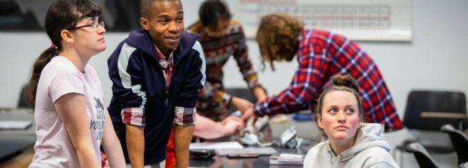 Students meet during class held in Cooke Hall. 