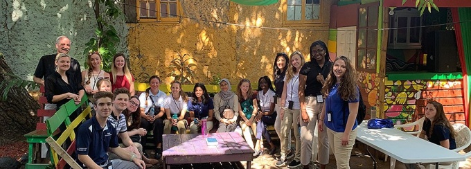 Group of people at an outdoor cafe in jamaica. 