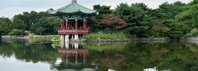 pagoda reflected in a body of water. 