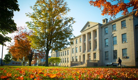 fall foliage in front of historic building. 