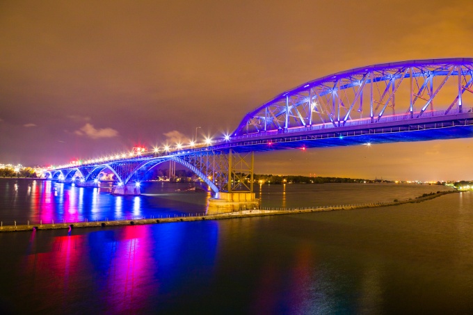 The Peace Bridge lit up at dusk. 