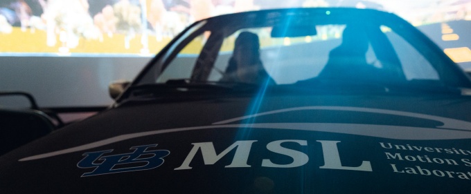 motion simulation lab written across front of simulator. 