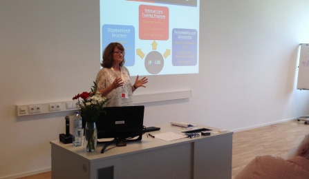 Lisa presenting at conference. 