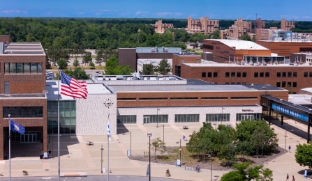 The exterior of One World Café, part of Norton Hall, and Founders Plaza, photographed in July 2025 from an aerial perspective. Credit Douglas Levere. 