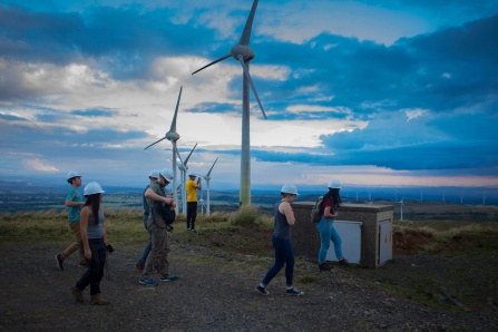 Students standing in front of windmills in Costa Rica. 