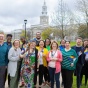 faculty and staff on the lawn on South Campus with progress pride flags. 