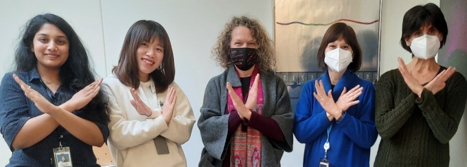 Five women strike the IWD #BreakTheBias pose. 