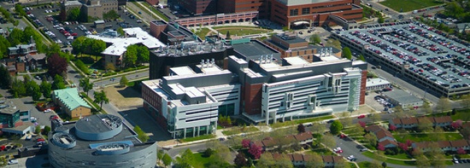 Photograph of the Jacobs School of Medicine and Biomedical Sciences, located in the city of Buffalo. 