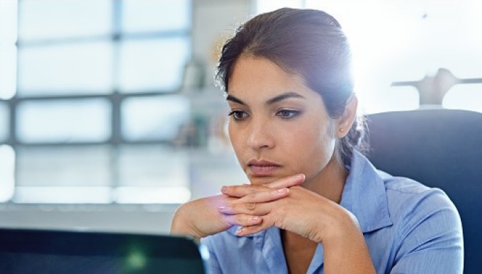 female faculty member at computer. 