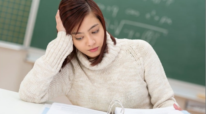 female grad student looking stressed. 