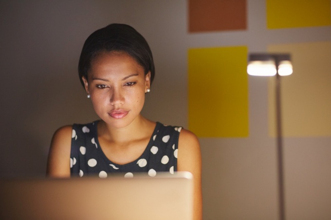female engineer looks at computer. 