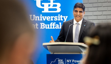 Venu Govindaraju speaks from a lectrun at a news conference.