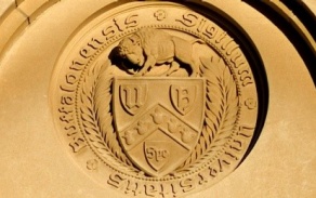 UB shield with buffalo etched into a building. 