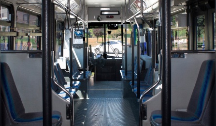 Interior of a UB Stampede bus with advertising rails above the seats. 